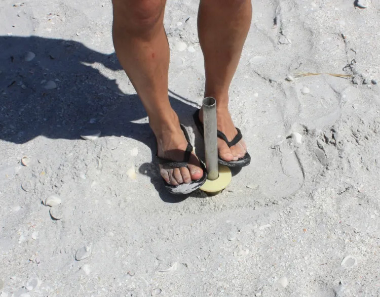 Beach Umbrella Anchoring System How To Install - press the umbrella-stop down
