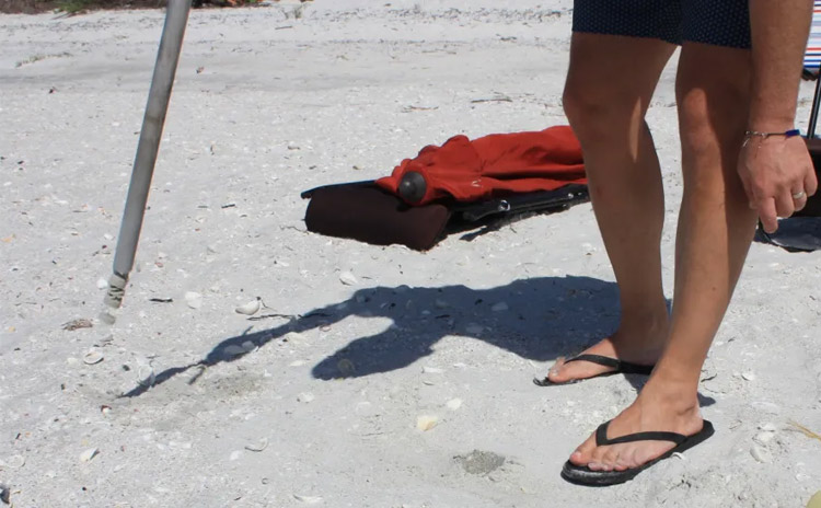 Beach Umbrella Anchoring System How To Install - pull up, and shake out